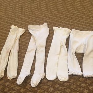 Set of white tights 6-18 months good condition